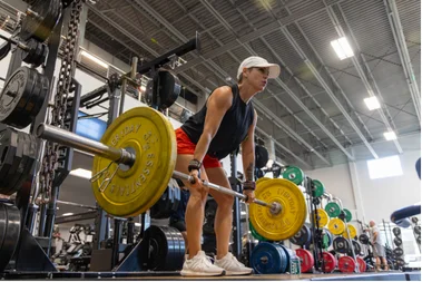A Fit-N-Wise member deadlifting in the free-weight area