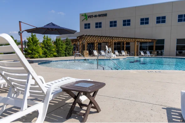 Shaded seating beside the outdoor pool
