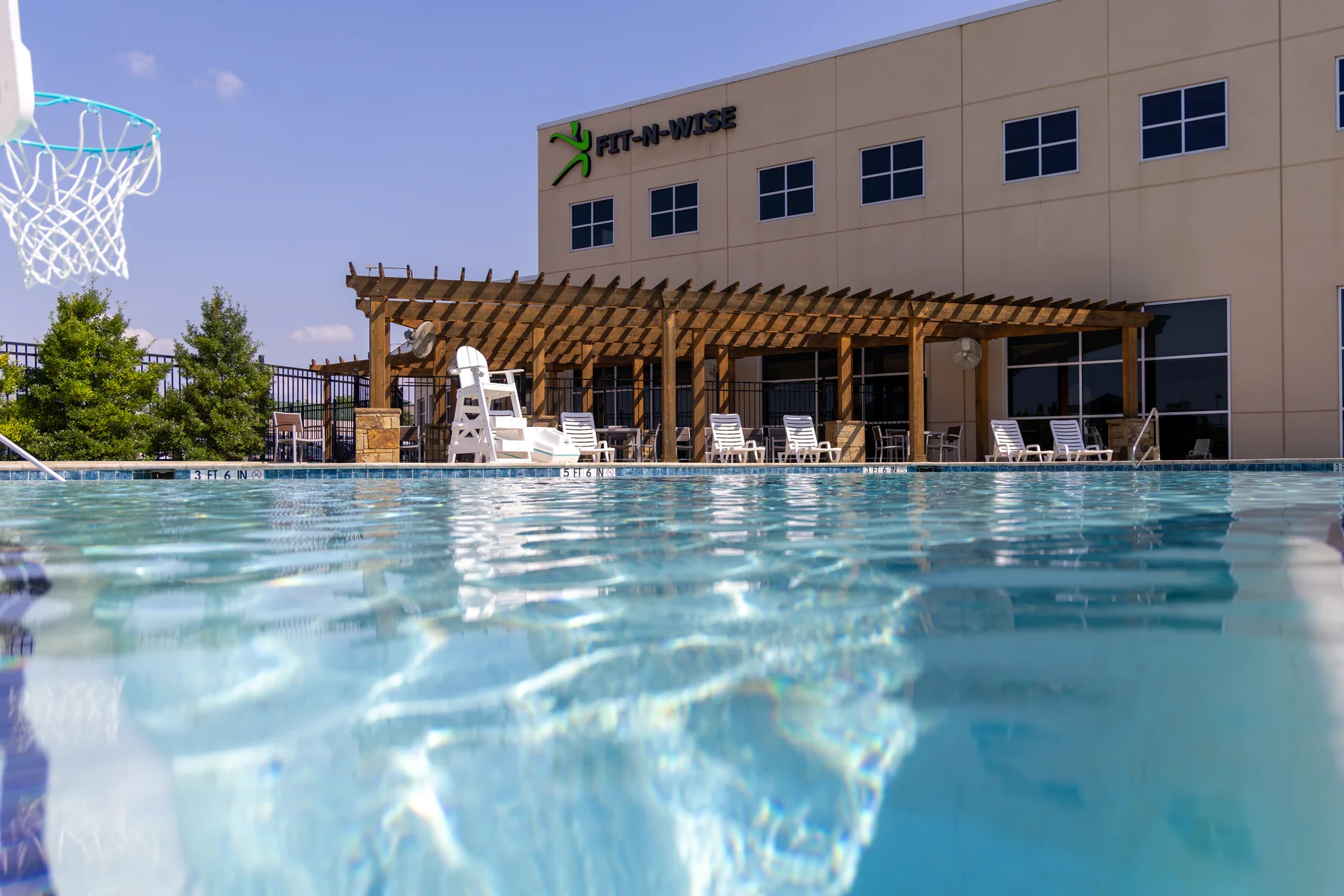 Fit-N-Wise building exterior and outdoor pool in Decatur, Texas