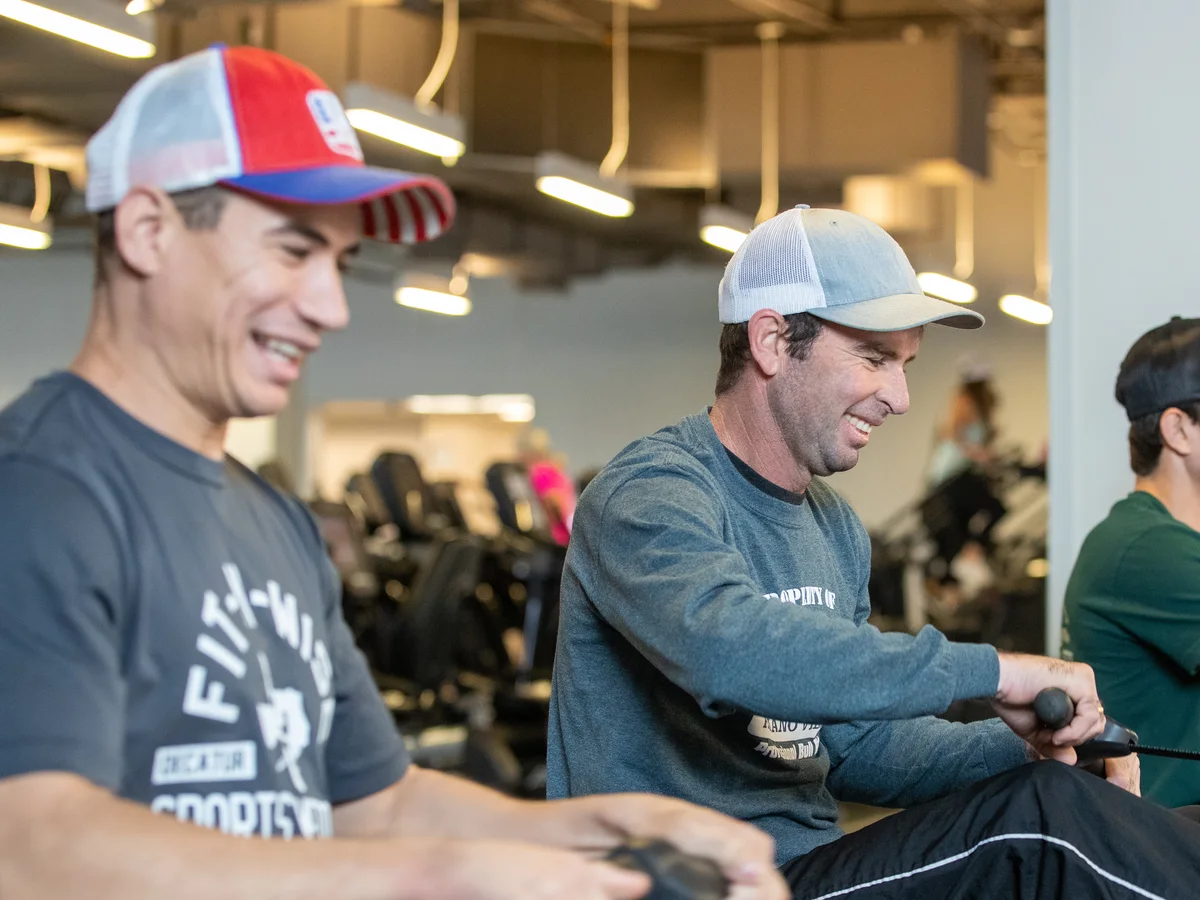 Fit-N-Wise members training side by side on rowing machines