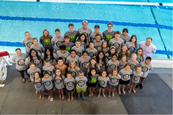 The Fit-N-Wise Swim Team on the pool deck